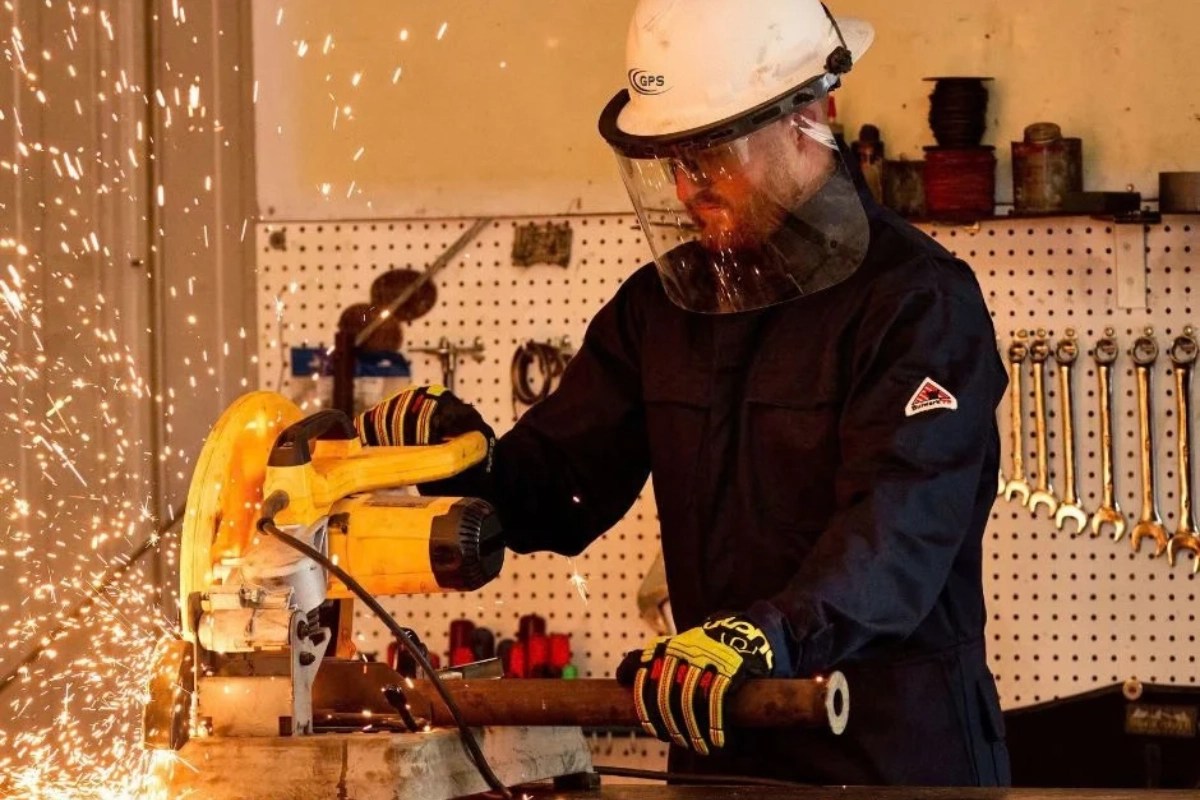 man wearing flame resistant shirt while working